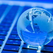 The business concept of the glass world on a laptop The business concept of the glass world on a laptop keyboard