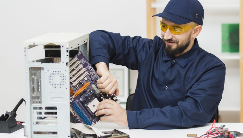 front-view-man-repairing-computer
